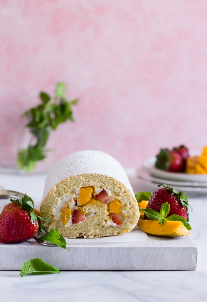 Mango Strawberry Roulade Recipe - Vanilla Sponge Cake filled with Cream Cheese Whipped Cream frosting and Mangoes and Strawberries! Swiss Roll Recipe. Swiss Roulade Recipe. Roulade Recipe. Jelly Rolls Recipe. The Ultimate Summer Dessert Recipe. Summer Cake Recipe